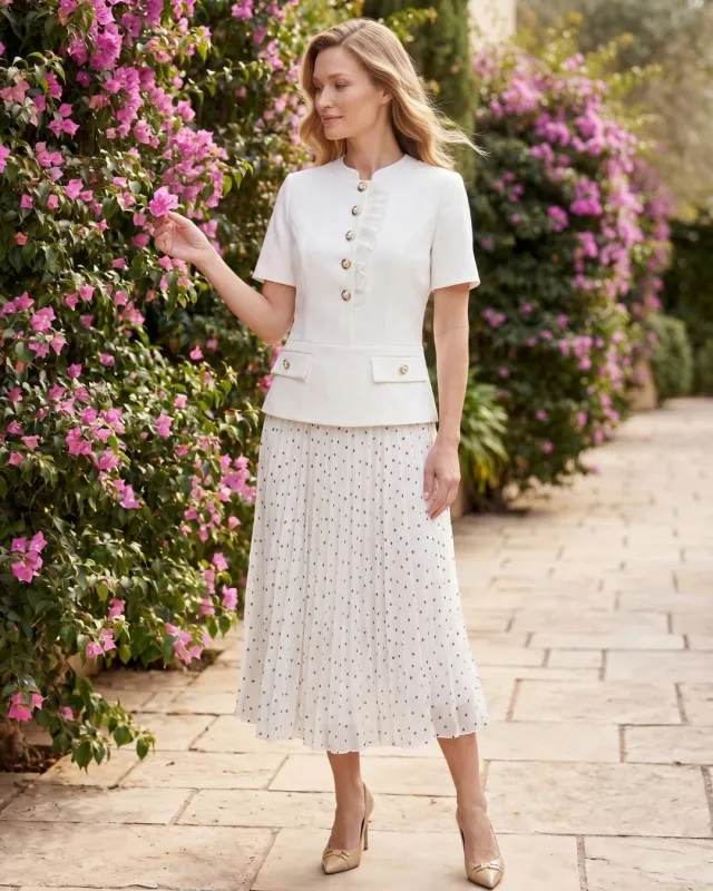 Elegant women's set with a pleated polka dot midi skirt