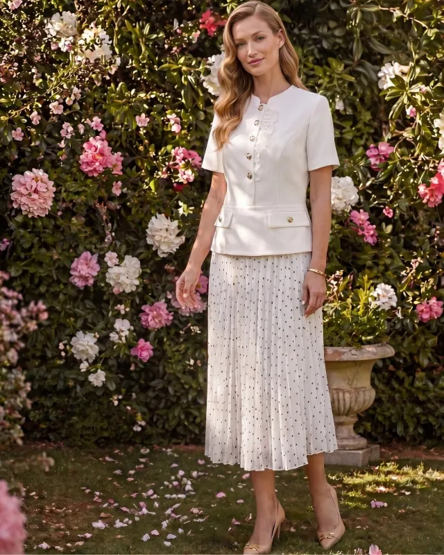 Elegant women's set with a pleated polka dot midi skirt