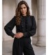 Black blouse with a stand-up collar, jabot, and buttons